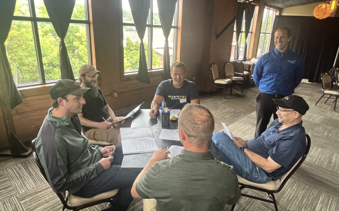 Metamorphosis CCT Trainer Facilitating a Conversation Between Team Members at the Xeratec Team Training Day